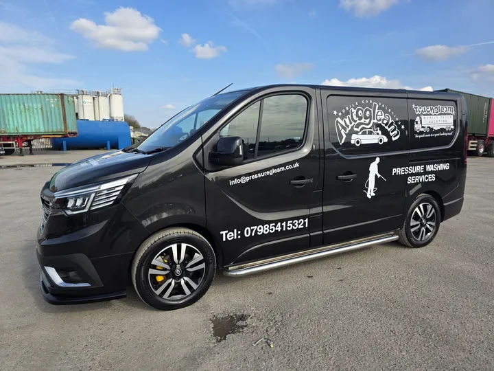 Our black Auto Gleam valeting van with the company logo and phone number on the side